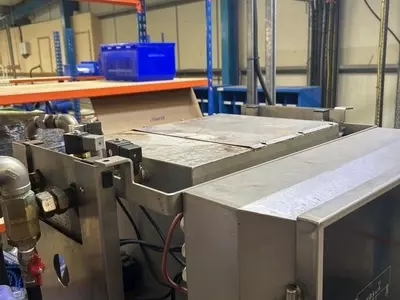 Original Nilfisk SC Delta multi-pump system in a Birmingham food factory prior to upgrade, showing the existing smaller water tank setup that struggled to keep up with high-demand clean-down operations.